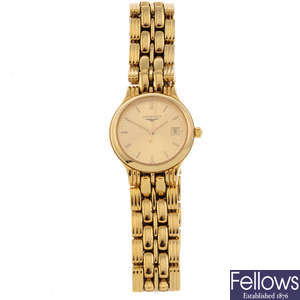 LONGINES - a lady's gold plated bracelet watch.