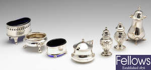 A selection of seven late Victorian and later silver condiments, etc.