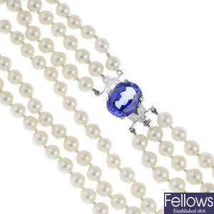 A cultured pearl three-row necklace, with sapphire and diamond clasp.