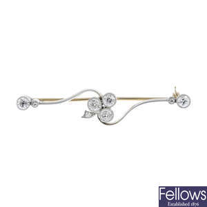 An early 20th century platinum and gold diamond bar brooch.
