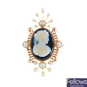 An onyx and split pearl brooch.