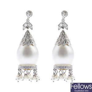 A pair of cultured pearl, diamond and seed pearl earrings.