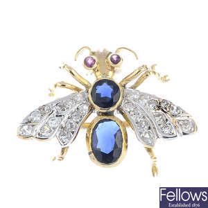 An early 20th century gold sapphire, diamond and ruby insect brooch.