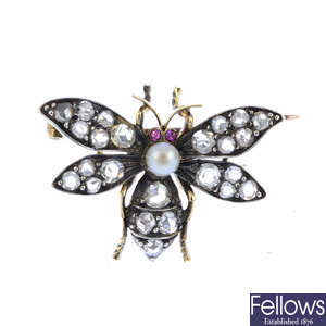 A late Victorian silver and gold gem-set bee brooch.