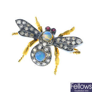 A gem-set bee brooch.