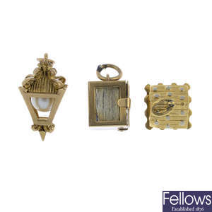 Four mid 20th century gold charms.