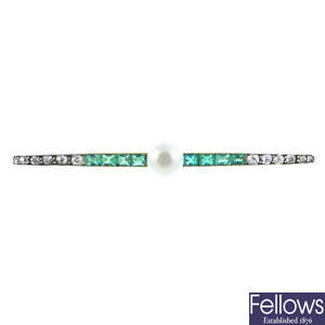An early 20th century 14ct gold and silver, pearl, emerald and diamond bar brooch.