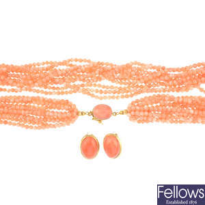A coral multi-strand necklace and a pair of matching earrings.