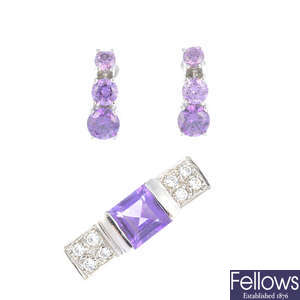 An 18ct gold amethyst and diamond ring and a pair of cubic zirconia earrings.