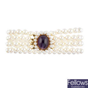 A cultured pearl four-row bracelet, with amethyst and seed pearl clasp.