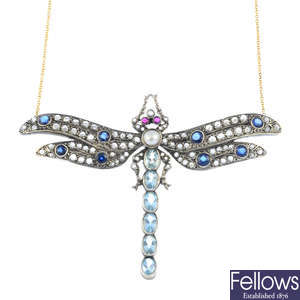 A diamond, aquamarine, split pearl and ruby dragonfly necklace.