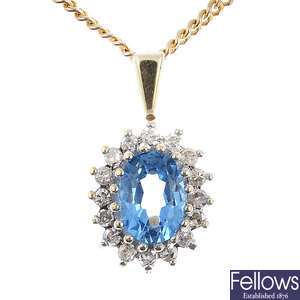 A 9ct gold topaz and diamond cluster pendant, with chain.