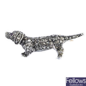 A late Victorian silver and gold diamond and ruby dog brooch.