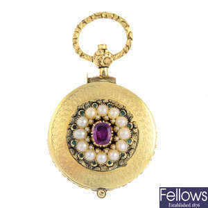 A mid Victorian gold ruby, split pearl and emerald magnifying locket.