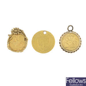 Six gold coin pendants.