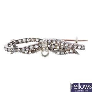 A late Georgian silver and gold diamond bow brooch.