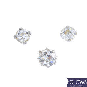A pair of diamond stud earrings, a stud and a loose paste.