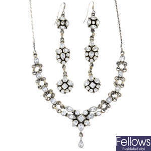 A cubic zirconia necklace and earrings.