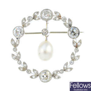An Edwardian platinum diamond and natural pearl wreath brooch.