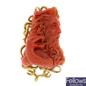 A 1970s 18ct gold carved coral cameo brooch, by E. Wolfe & Co.