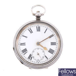 A silver open face pocket watch with two pocket watches.