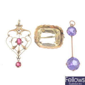 Three gem-set pendants and a brooch.