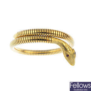 A 9ct gold flexible snake bangle.