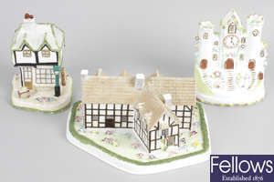 A collection of thirty one Coalport bone china cottages and buildings.