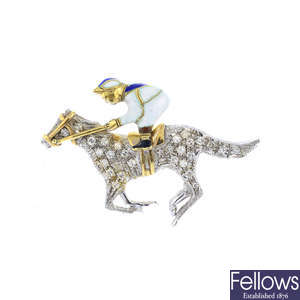 A diamond and enamel horse and jockey brooch.