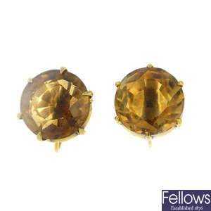 A pair of citrine single-stone earrings.