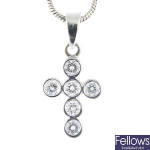 An 18ct gold diamond cross pendant, with 18ct gold chain.