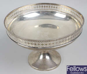 An early 20th century silver pedestal dish, plus a small silver dish, 3 spoons, pair of sugar tongs & button hook.