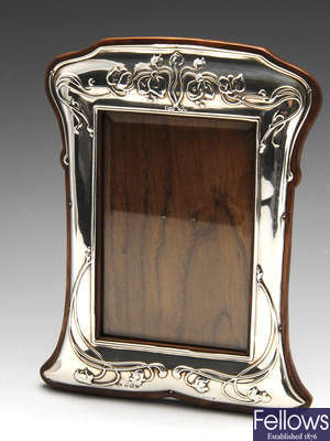 An Edwardian silver mounted photograph frame.