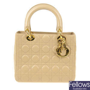 CHRISTIAN DIOR - a beige Cannage Quilted Lady Dior MM handbag.