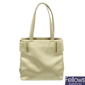 PRADA - a small beige satin handbag.
