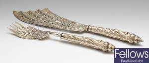 A mid-Victorian pair of silver ornately decorated fish servers.