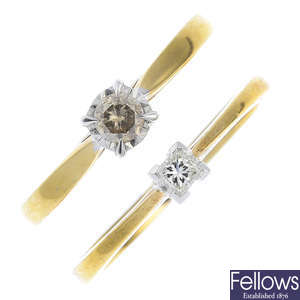 Two gold diamond single-stone rings.