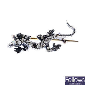 A late Victorian silver and gold diamond lizard brooch.