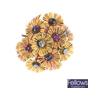 A 14ct gold diamond, ruby and sapphire floral dress ring.