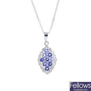 A 9ct gold tanzanite and diamond cluster pendant, with 9ct gold chain.