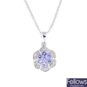 A 9ct gold tanzanite and diamond pendant, with 9ct gold chain.
