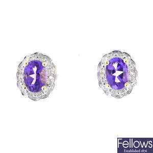 A pair of 9ct gold amethyst and diamond cluster earrings.