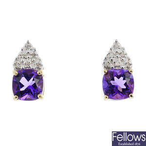 A pair of diamond and amethyst earrings.
