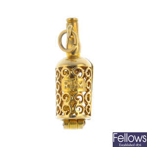 A 9ct gold 'Ship in a bottle' charm.
