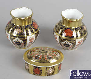 A pair of Royal Crown Derby Old Imari bone china vases, together with two similar oval pill boxes and covers, trinket dish, etc.