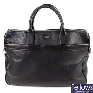 HUGO BOSS - a black leather briefcase.
