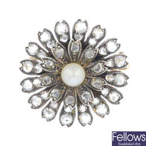 A diamond and pearl brooch.