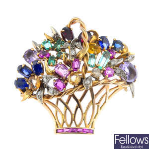 A mid 20th century gold diamond and gem-set floral basket brooch.