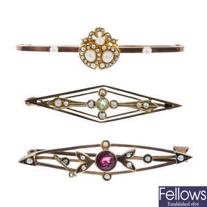 Three early 20th century 9ct gold gem-set brooches.