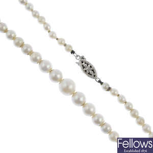 A cultured pearl single-strand necklace and earrings.